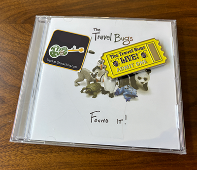 Found It! CD, trackable sticker, and ticket geocoin package